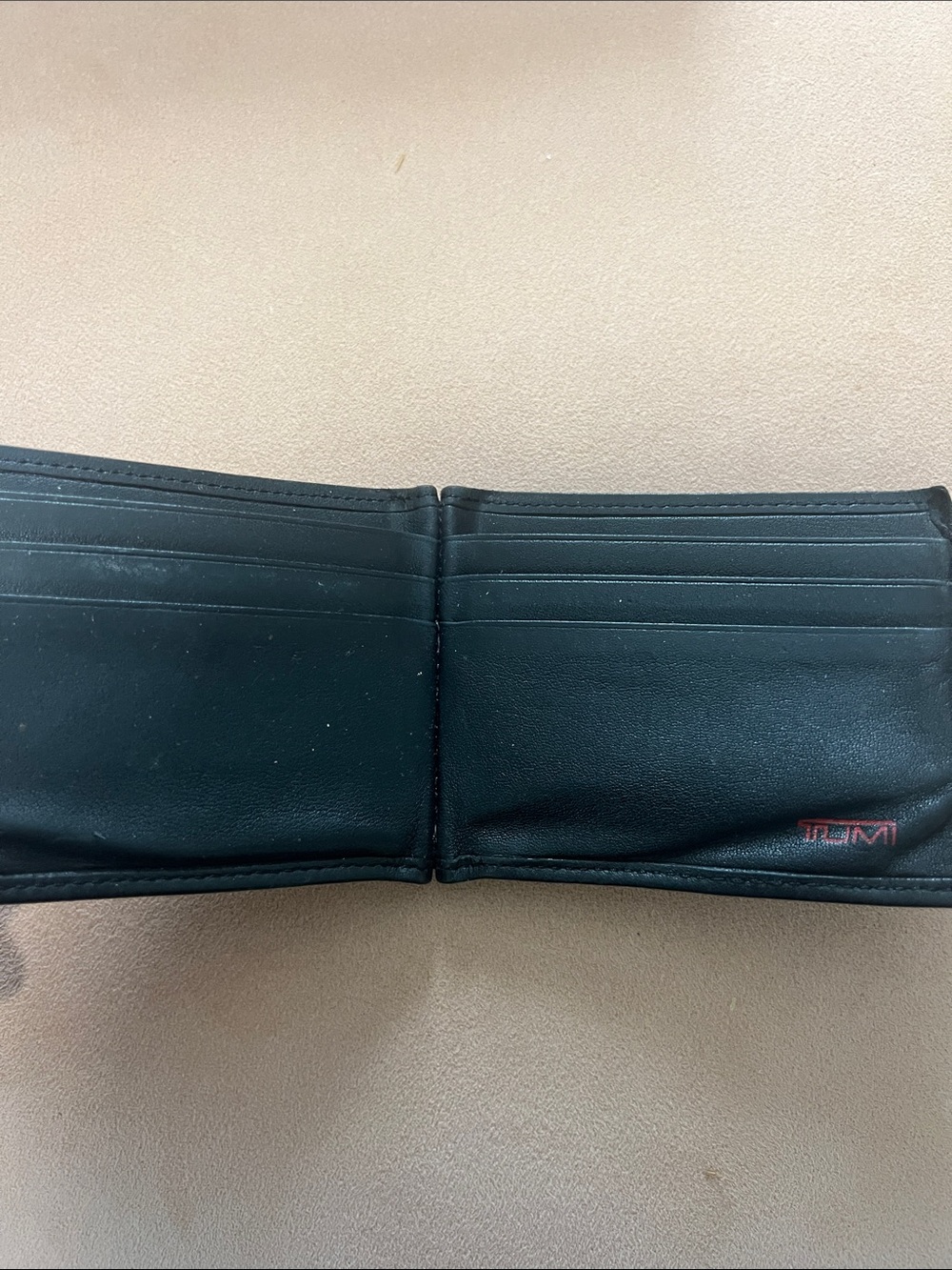 Tumi Black Leather Bi-Fold Wallet with Red Logo